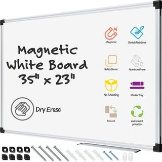 A large whiteboard with magnetic pens and wall mounting screws. 