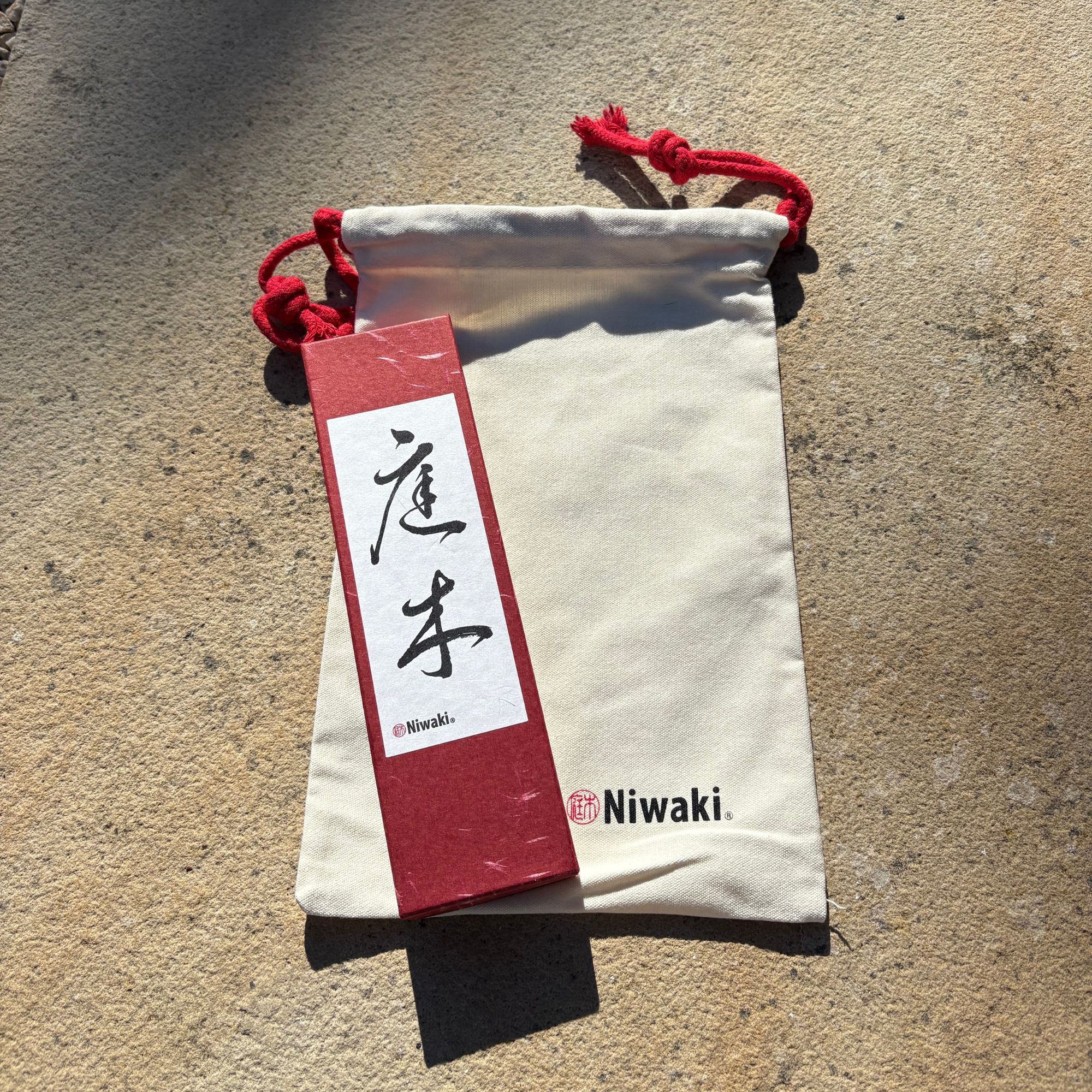Niwaki Sentei Secateurs box and canvas bag in garden