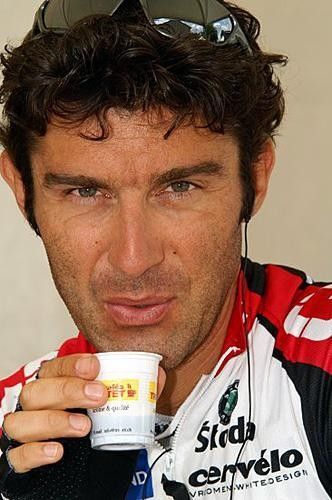 Andrea Peron (CSC) sips a bit of coffee before the start of stage 1