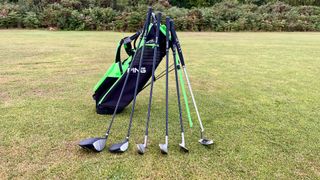 The stunning Ping Prodi G Junior Set Review resting on the golf course showing off their excellent design and green colorway