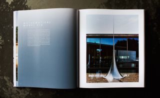Book open at a page showing Mathematical Model 012, by Hiroshi Sugimoto, 2010