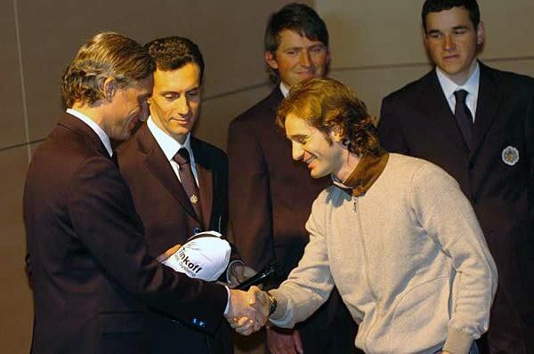 Tinkov and Trulli on stage.