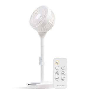 An IRIS USA WOOZOO Pedestal Standing Fan with its remote on a white background