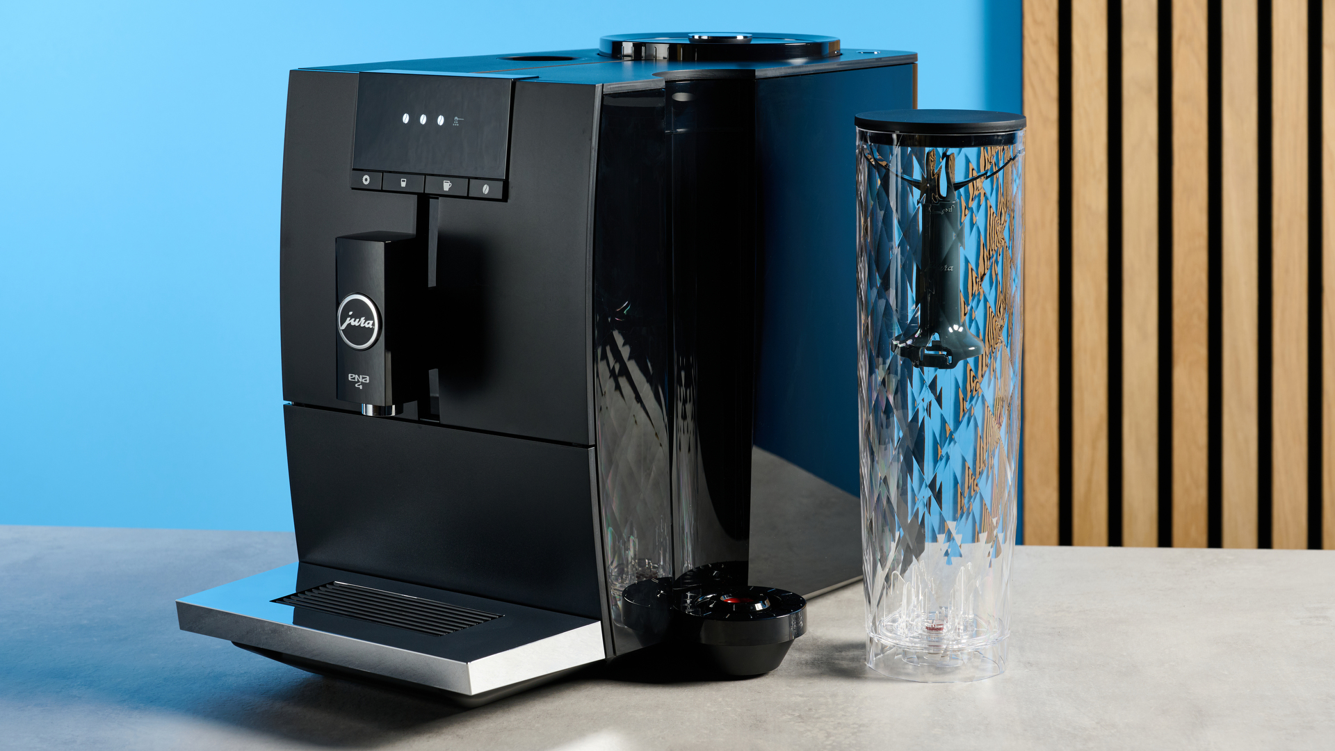 the jura ena 4 automatic coffee machine in piano black with a faceted water tank and bright screen