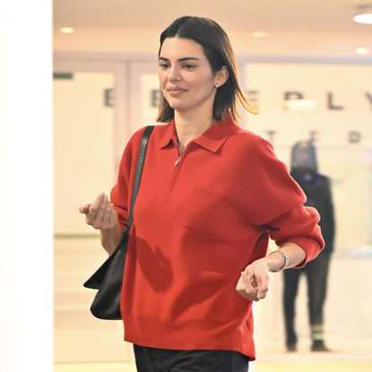 Kendall Jenner is seen on January 05, 2025 in Los Angeles, California wearing a red half-zip sweater and black jeans