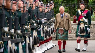 King Charles III inspects Balaklava Company, 5th Battalion, The Royal Regiment of Scotland, at the gates of Balmoral, as he takes up summer residence at Balmoral Castle on August 21, 2023