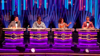 Shirley talks as the other judges look on