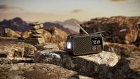 Philips TAR3500 portable radio outdoors on a rocky background 