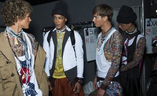 Male models chatting, wearing Dsquared2 collection