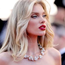 Elsa Hosk wears red lipstick and a diamond necklace