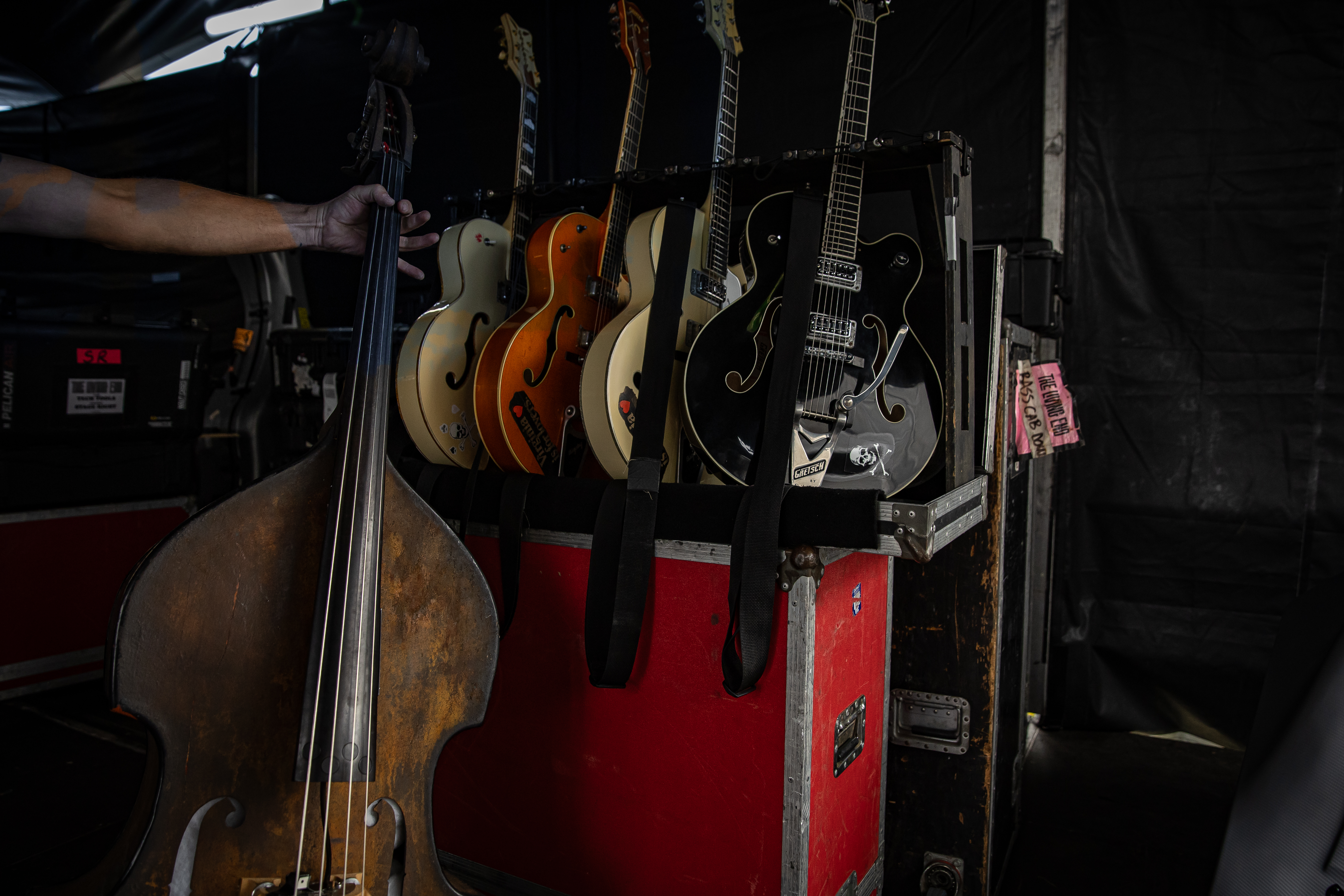 An array of Gretsch guitars in storage