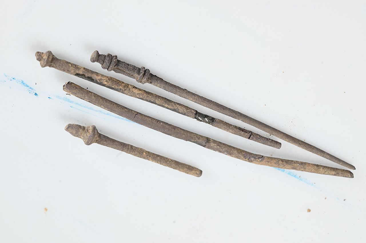 four metal pins