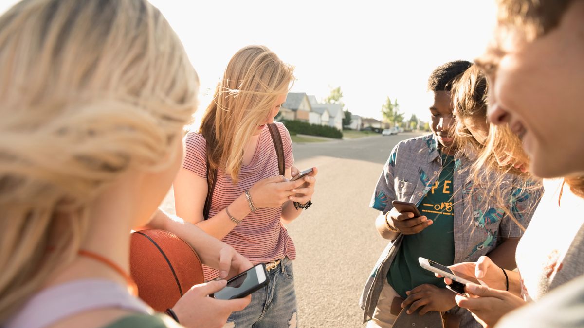 Teenagers using social media apps