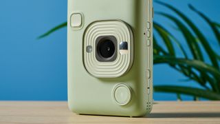 A matcha green Fujifilm Instax mini LiPlay 2-in-1 instant camera and printer