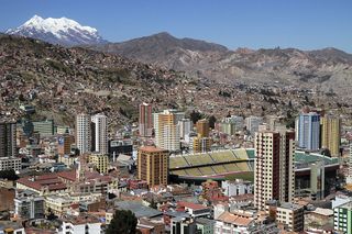 Hernando Siles stadium, with the Illimani mountain behind, on May 29, 2012 in La Paz, Bolivia. Hernando Siles stadium can host 42,000 spectators and is the biggest sports complex in Bolivia. It is situated at 3604 meters over the sea level and is the venue for the Bolivian national team games.