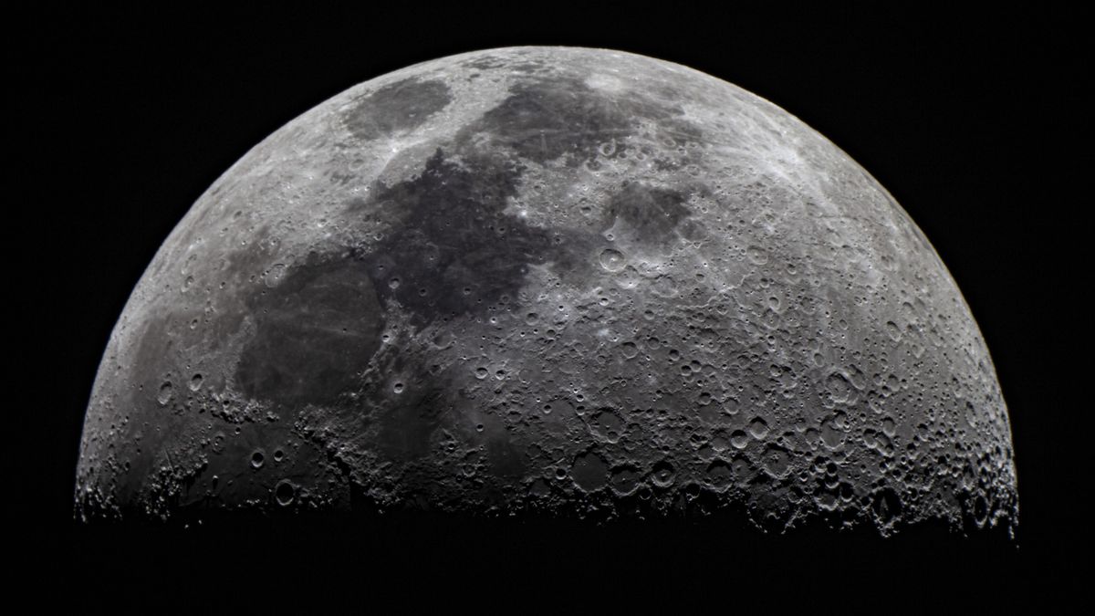 close up image of the moon showing the lunar surface covered in craters from many impacts of the moon&#039;s lifetime.