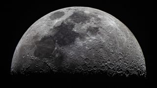 close up image of the moon showing the lunar surface covered in craters from many impacts of the moon's lifetime.