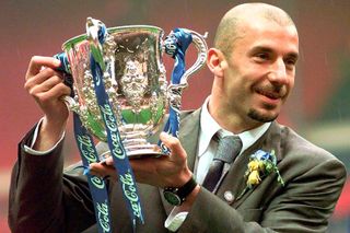 Chelsea player-manager Gianluca Vialli holds the League Cup after Chelsea's victory against Middlesbrough in the final, March 1998