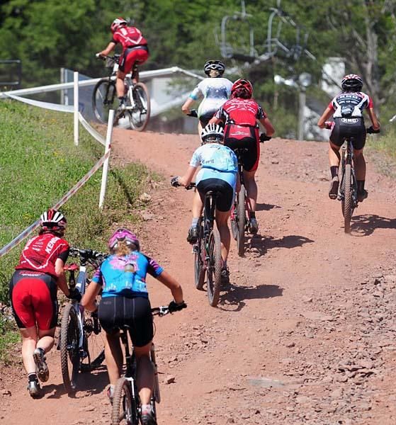 Mid-pack riders on a steep climb