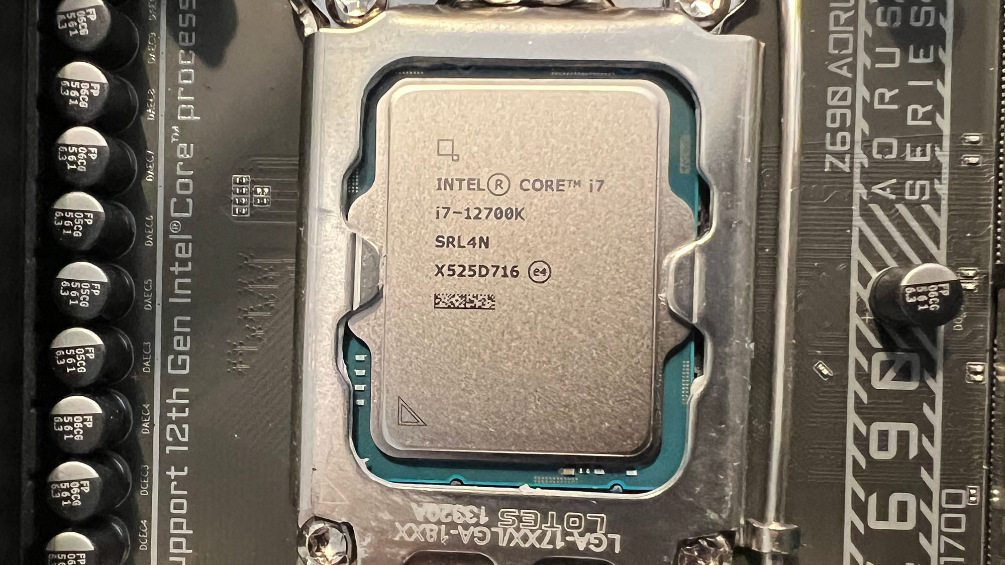 An Intel Core i7-12700K slotted into a motherboard socket