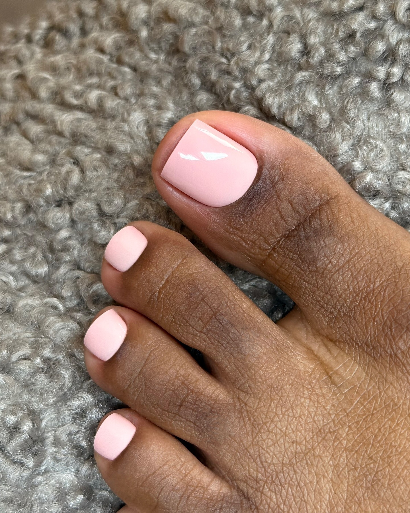 A soft pink pedicure