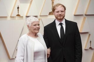 Dame Judi Dench attending the 94th Academy Awards with her grandson, Sam Williams, in 2022