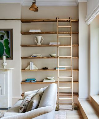 modern living room with custom open shelving and a ladder