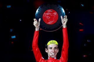 Simon Yates with the Vuelta trophy