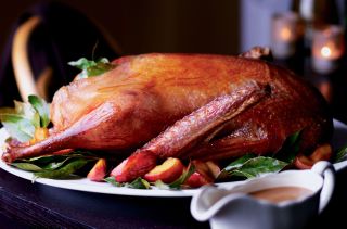 Roast goose with apple and bay leaves
