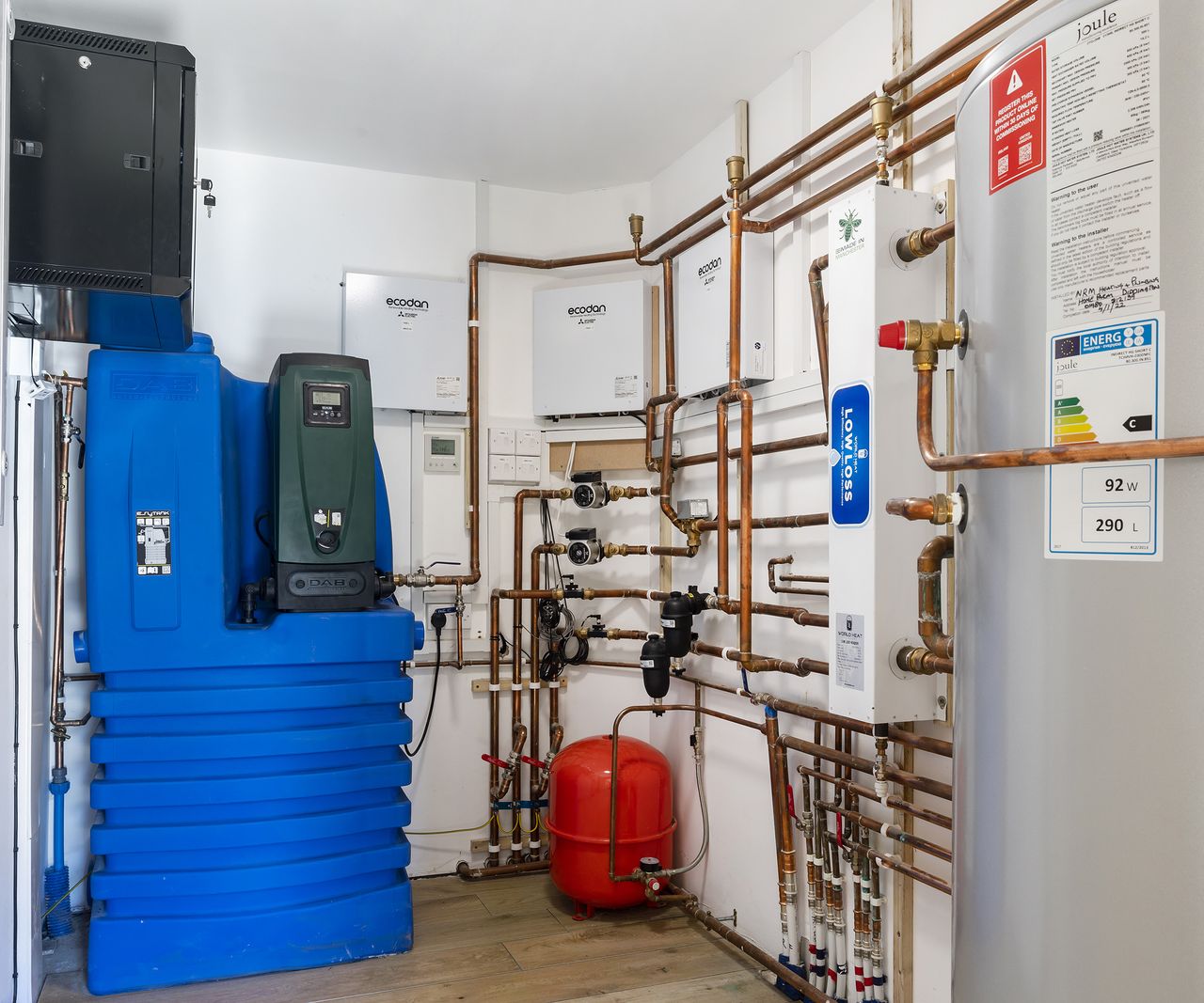 A room with multiple boilders powering a converted barn conversion