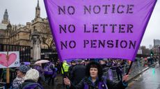 WASPI women at demonstration, with a purple banner saying 'no notice, no letter, no pension'