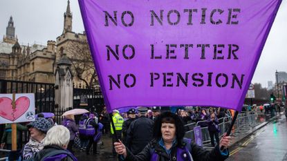 WASPI women at demonstration, with a purple banner saying 'no notice, no letter, no pension'
