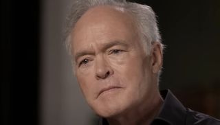 Scott Pelley cocks his head slightly during an interview on 60 Minutes.