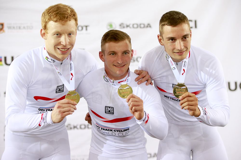 Joachim Eilers, Max Niederlag and Rene Enders of Germany celebrate with their gold medals after winning the Mens Team Sprint final