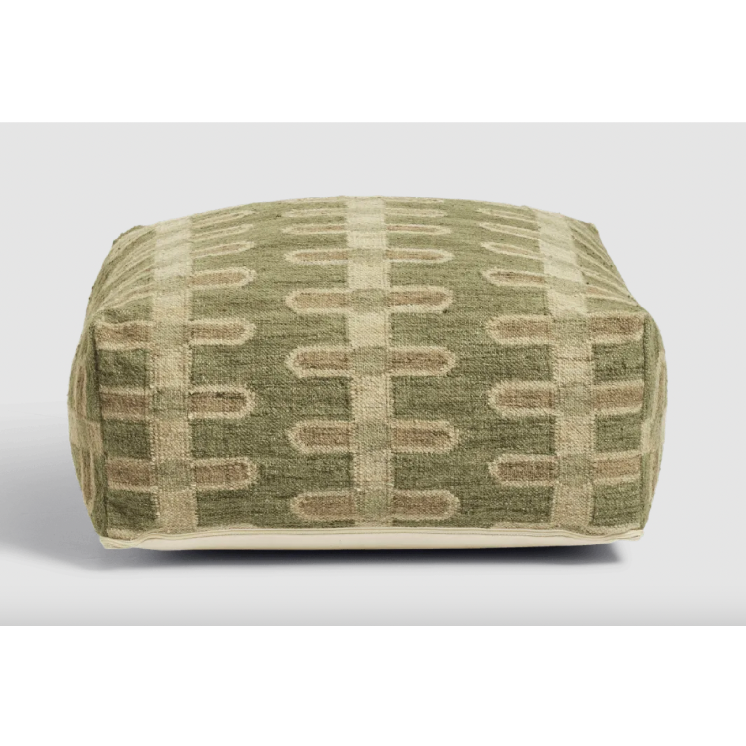 A green patterned pouffe
