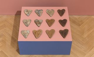 An assemblage of heart-shaped fake artefacts.