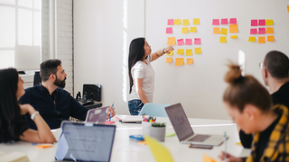 Group in office working with post-notes