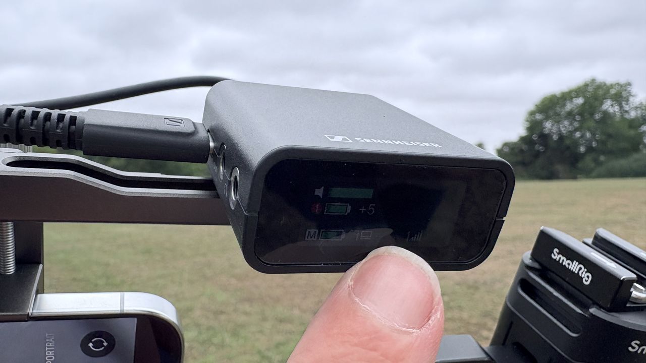 Shot of the receiver&rsquo;s OLED screen. The onscreen detail is not very visible due to bright sunlight and reflections on the screen