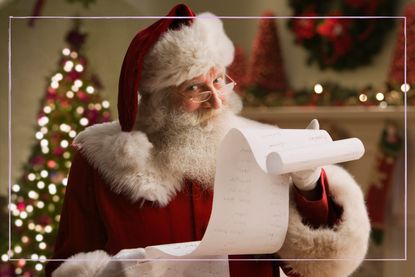 Santa Claus looking at a naughty and nice list