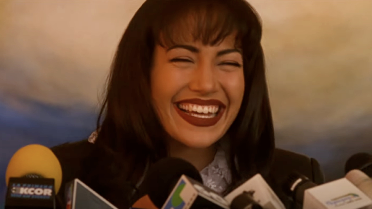 Selena smiling as she talks to the press