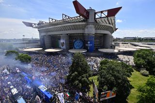 General view outside the stadium as FC Internazionale fans celebrate winning the title as the team bus arrives prior to the Serie A match between FC Internazionale Milano and Udinese Calcio at Stadio Giuseppe Meazza on May 23, 2021 in Milan, Italy. Sporting stadiums around Italy remain under strict restrictions due to the Coronavirus Pandemic as Government social distancing laws prohibit fans inside venues resulting in games being played behind closed doors
