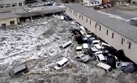 Cars collect at the side of a building as tsunami waves ravage Japan&amp;#039;s Kesennuma port earlier this month.