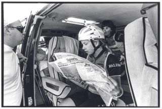 A rider checks over the Sports page of the Idaho Statesman newspapaer before the start of the 1987 Women's Challenge.