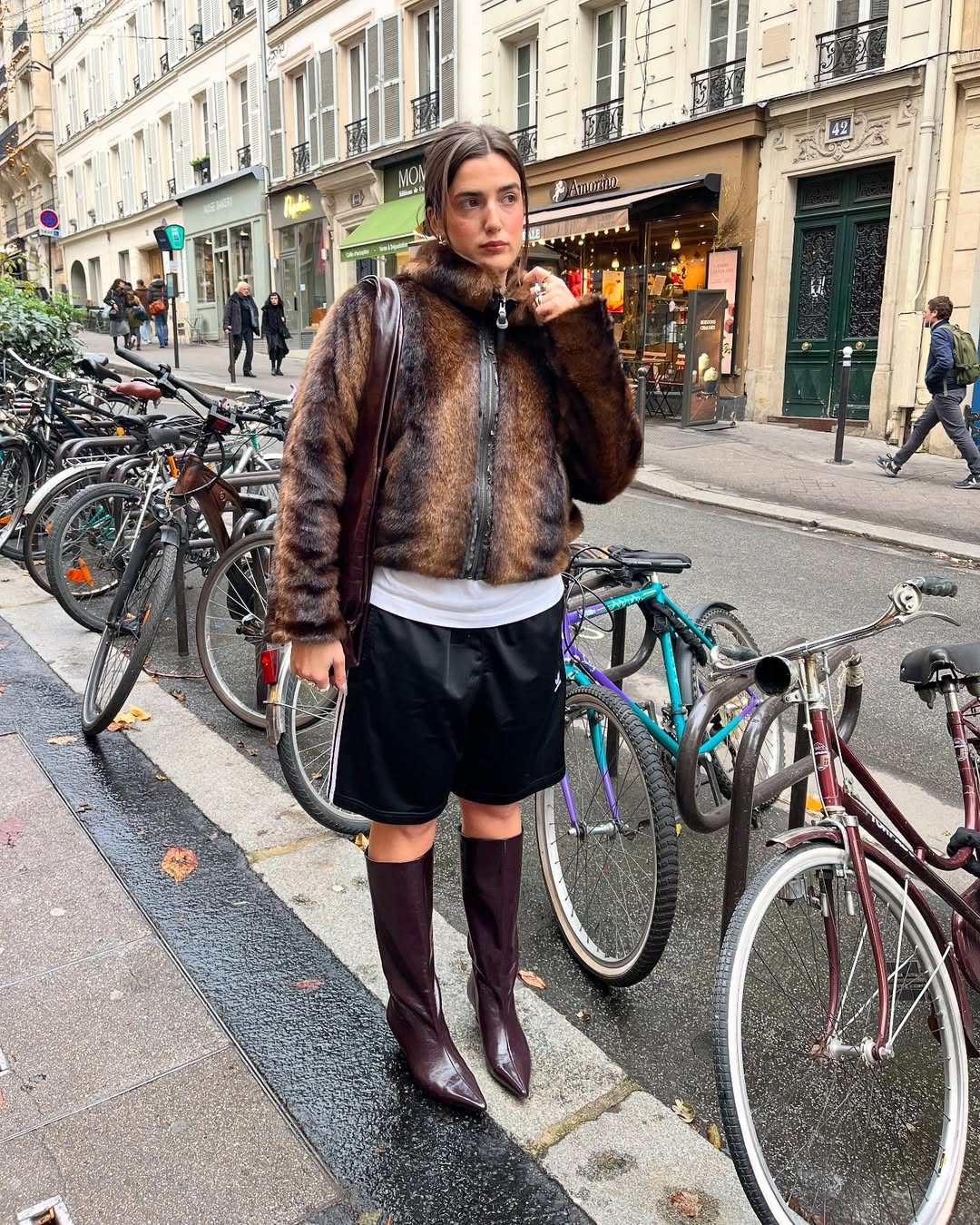 woman wearing bermuda shorts with boots outfit 2025