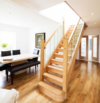 Timber and glass staircase in open-plan hallway