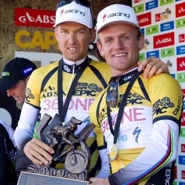 Christoph Sauser and Burry Stander receive their trophy for winning