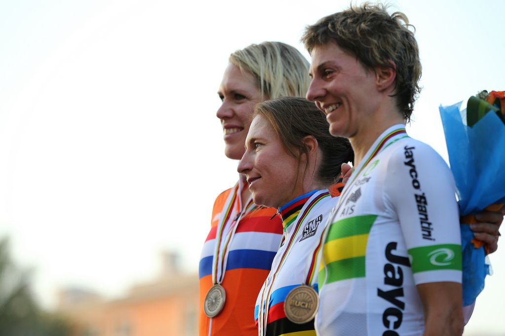The women's podium pose for the photographers