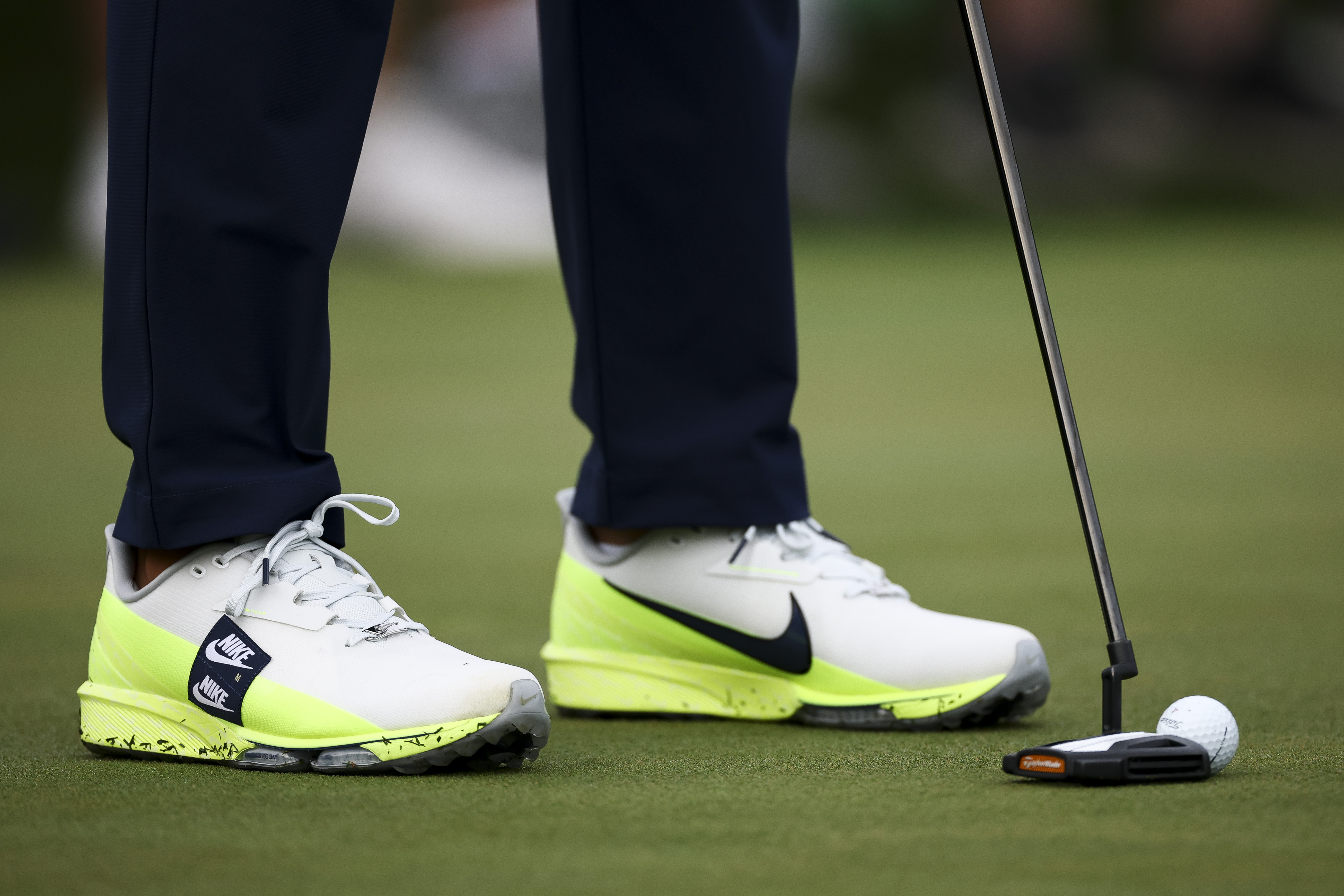 A detailed view of the shoes worn by Brooks Koepka during a practice round prior to the 2026 Masters Tournament at Augusta National Golf Club