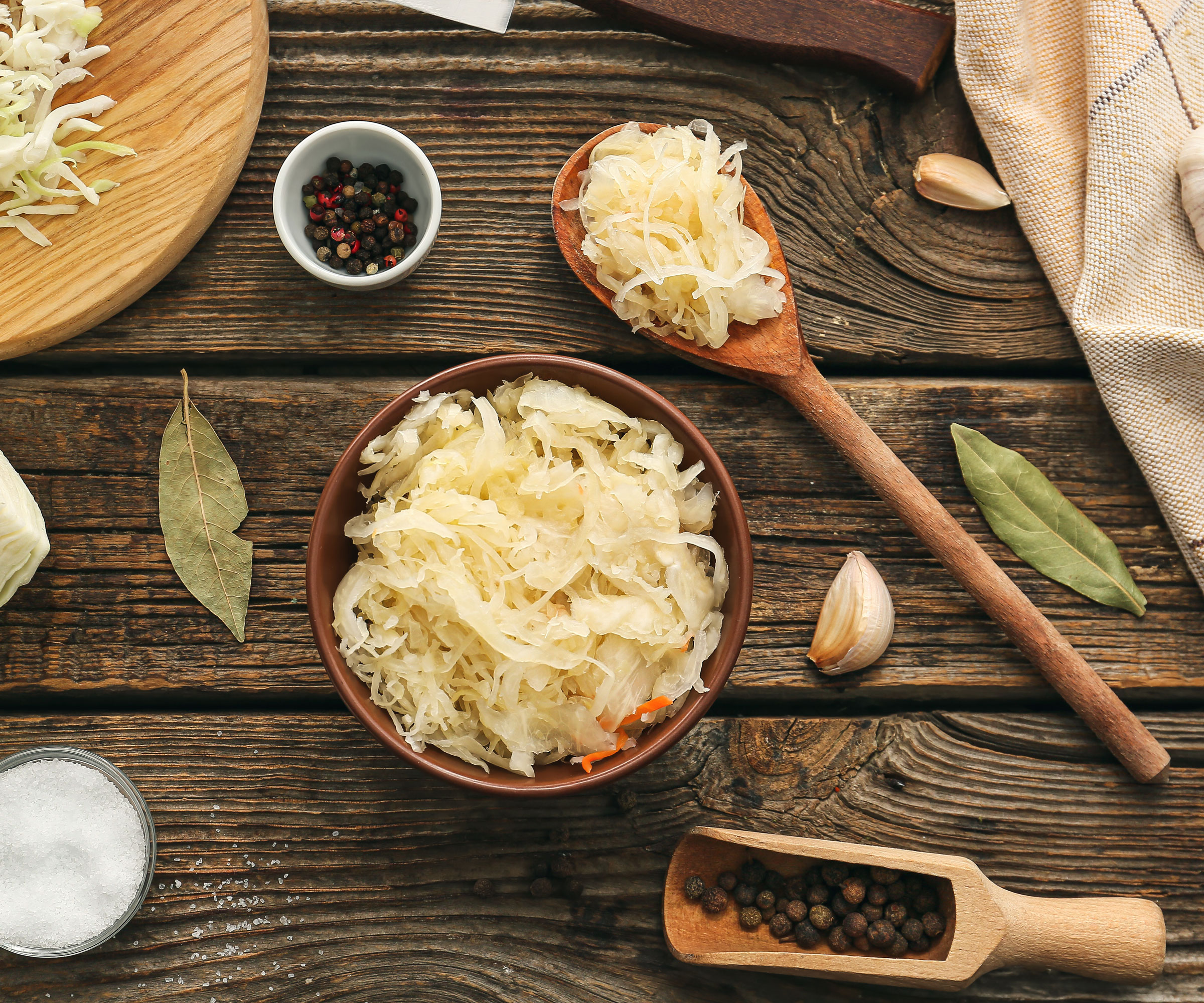 cabbage pickled in bowl on wooden table