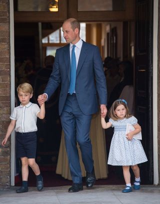 LONDON, ENGLAND - JULY 09: Prince William, Duke of Cambridge with Prince George and Princess Charlotte depart after attending Prince Louis' christening at the Chapel Royal, St James's Palace on July 09, 2018 in London, England. (Photo by Dominic Lipinski - WPA Pool/Getty Images)